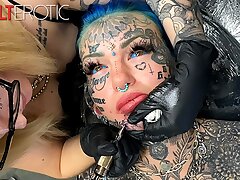 Gorgeous damsel glazed in tats gets another tat on her face